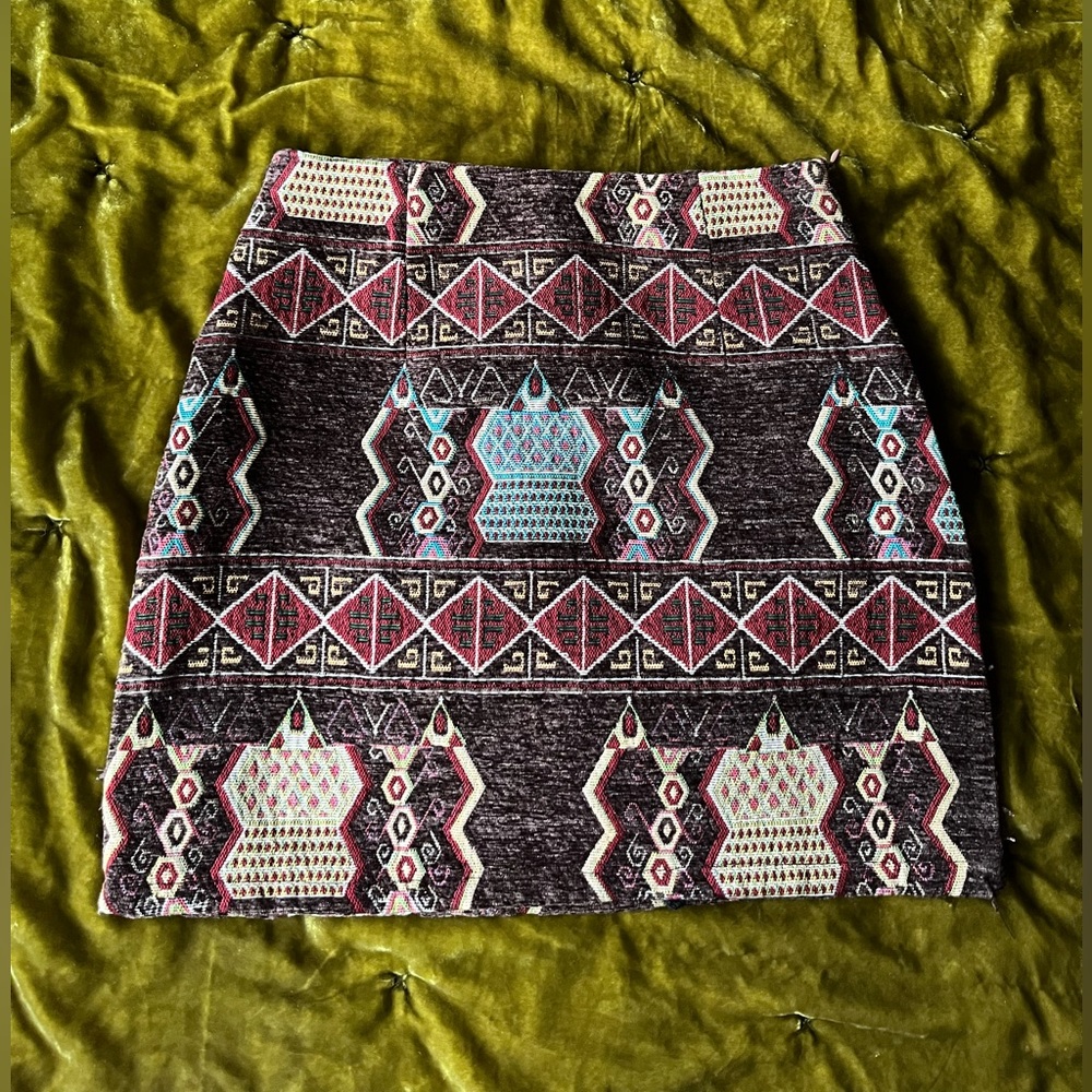 Patterned skirt. Shorts underneath.